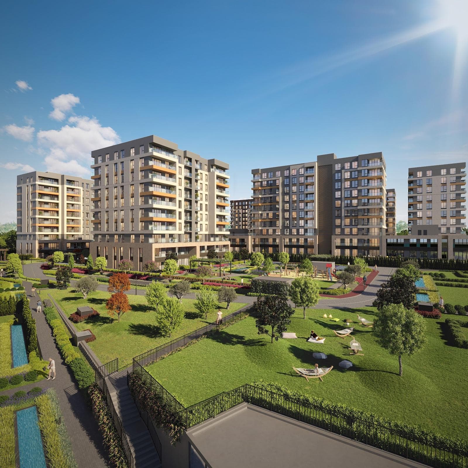 Daytime rendering of the mid-rise residential blocks seen across a sloping landscaped lawn with trees, hammocks and garden paths