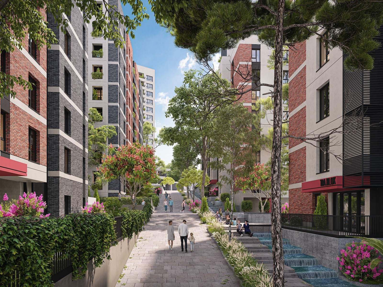 Tree-lined pedestrian path with steps and a cascading water channel between the blocks