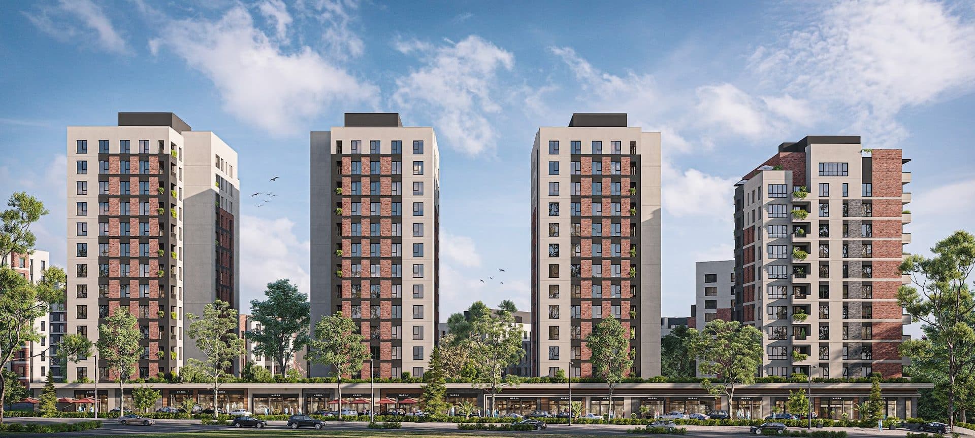 Row of four residential towers above a continuous line of street-front shops along the main road