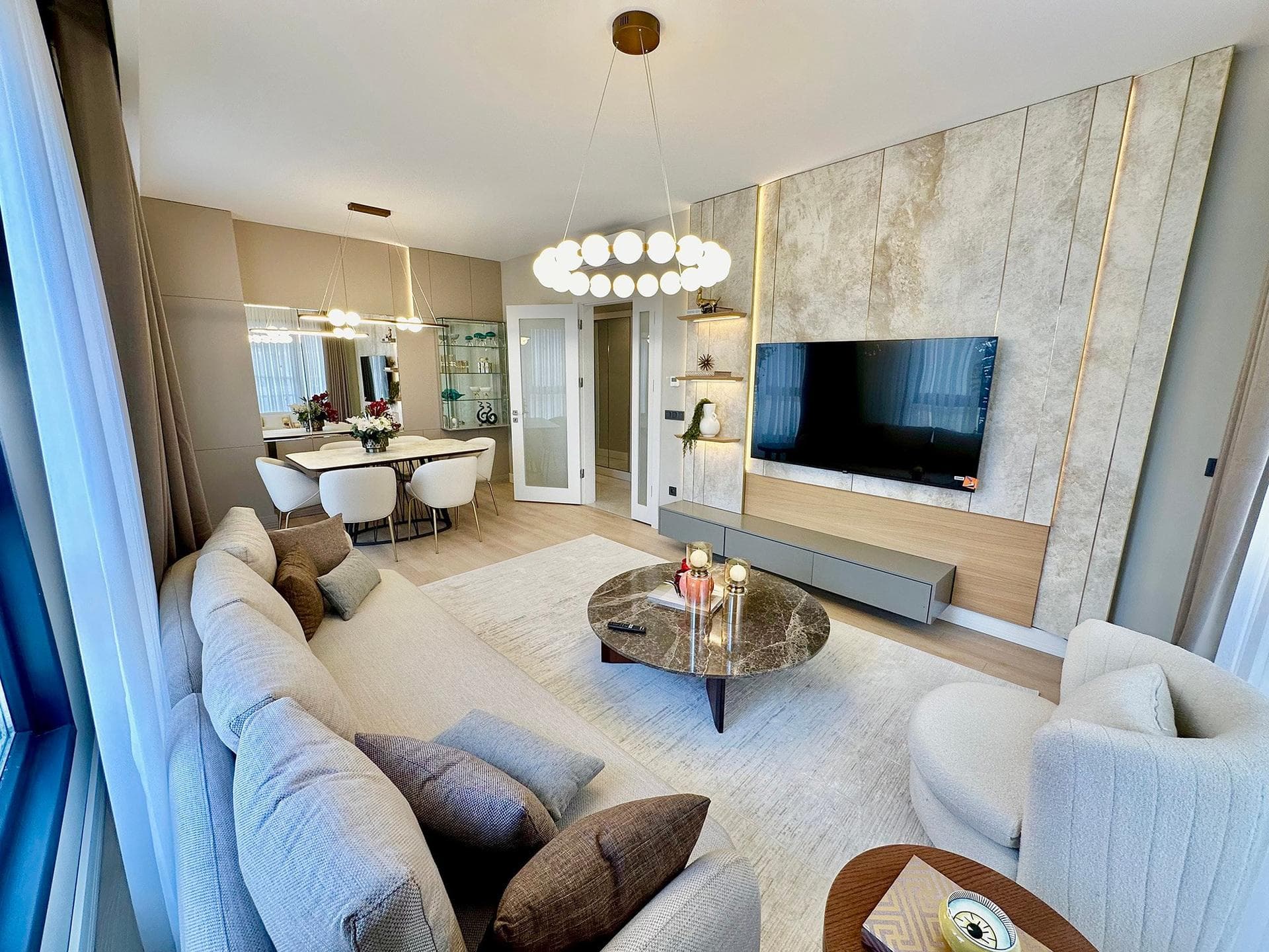 Living and dining room of the furnished 2+1 sample apartment