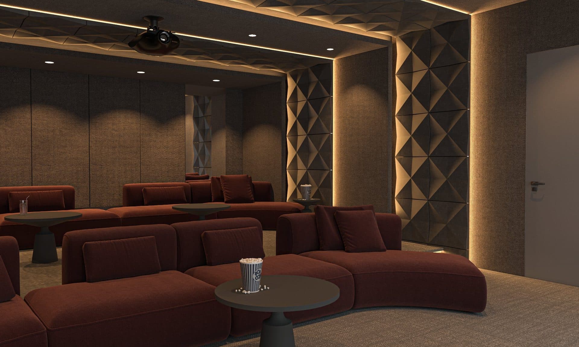 Small cinema room with dark red sofas, padded wall panels and a ceiling projector