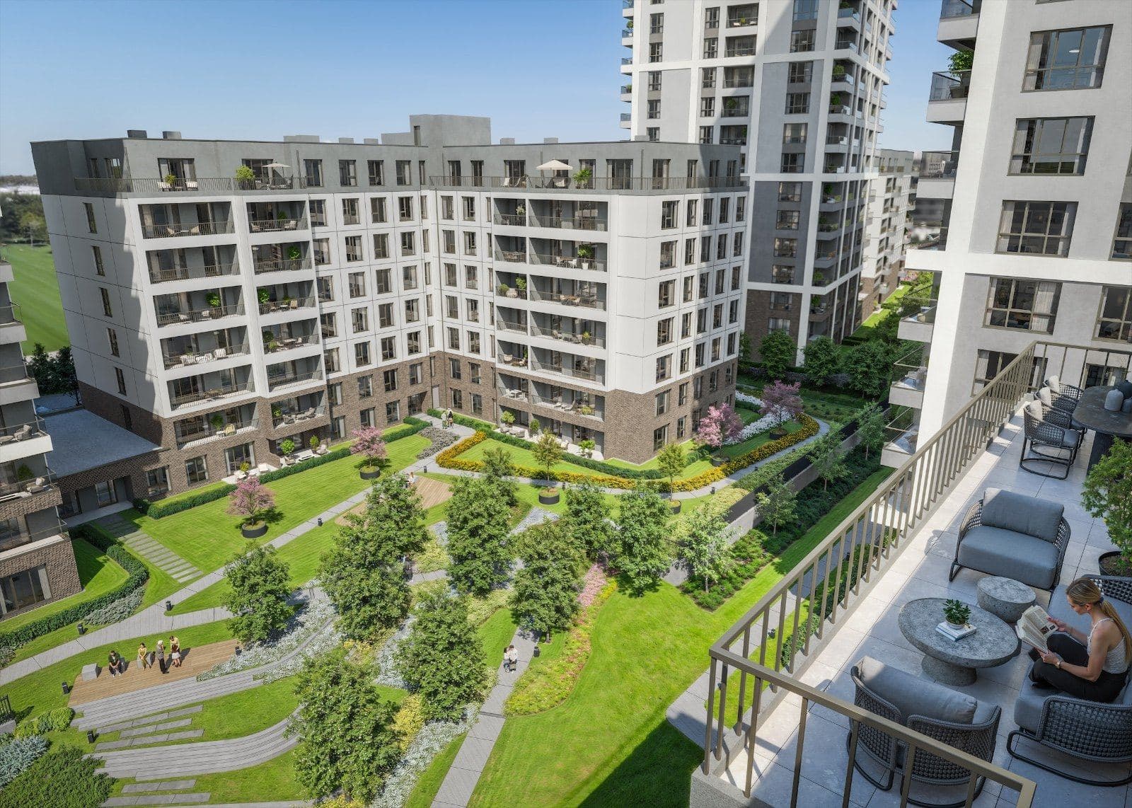 Landscaped courtyard between the blocks seen from a furnished balcony