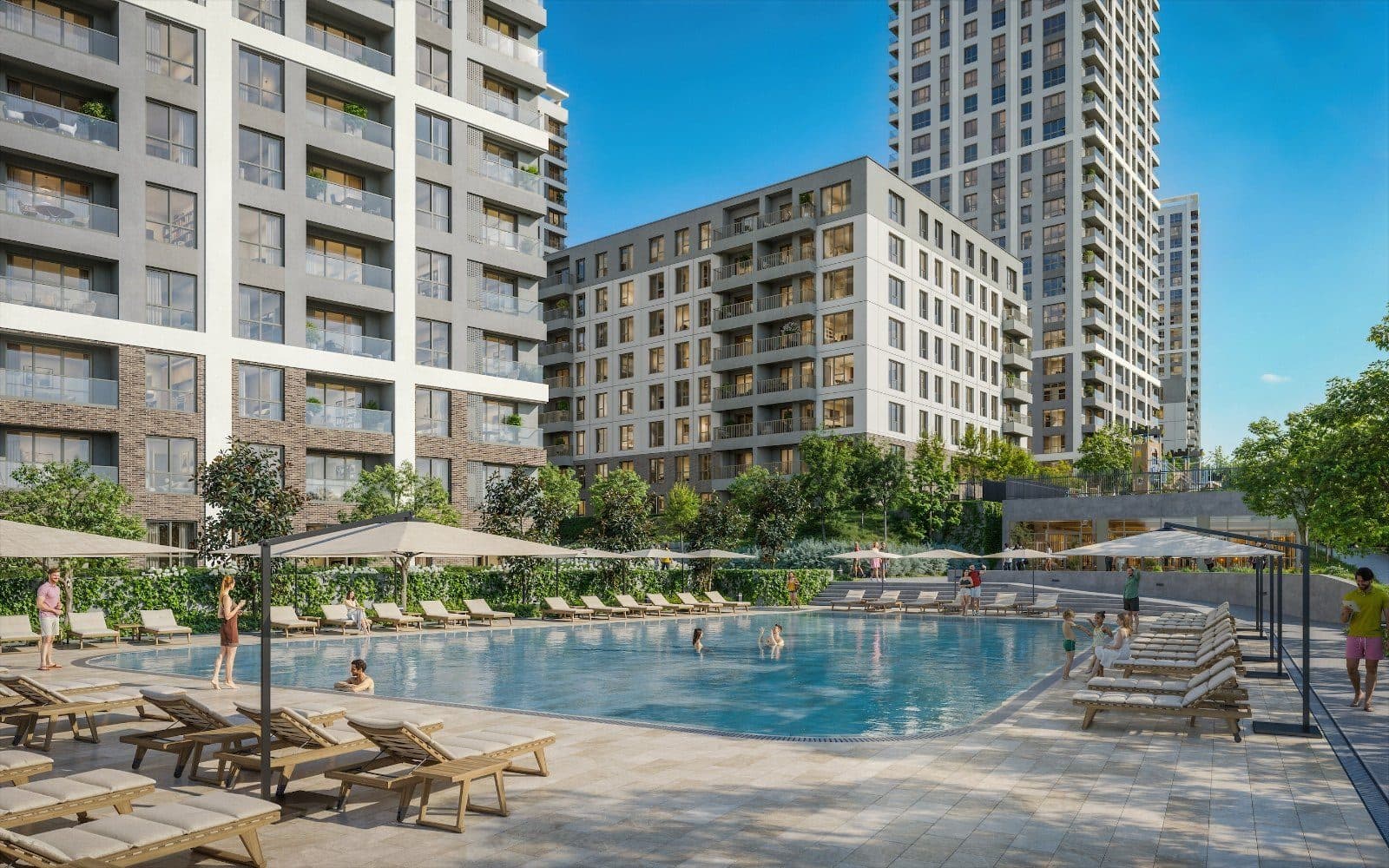 Outdoor swimming pool with sun loungers and umbrellas between the blocks