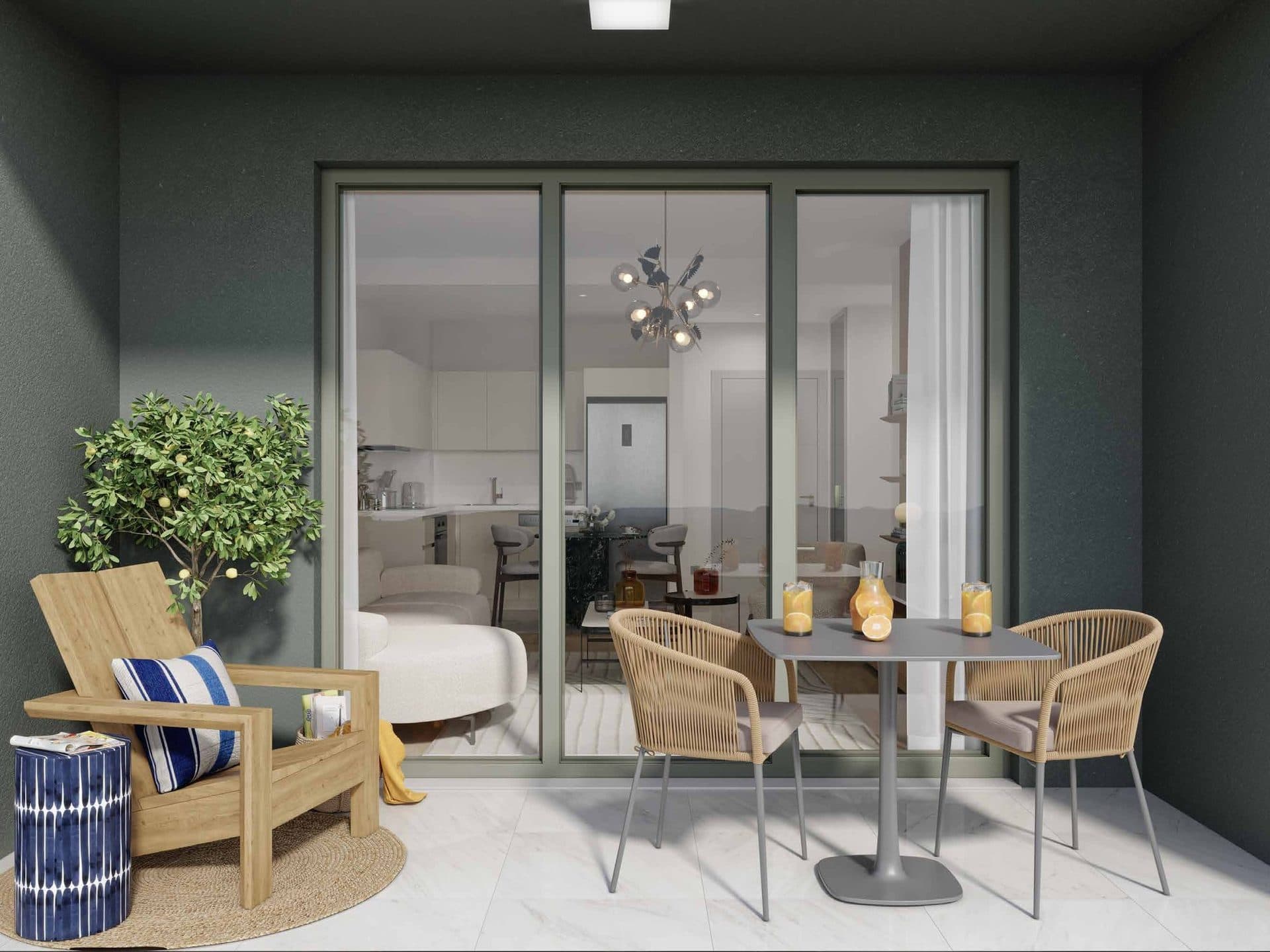 Furnished balcony with a table and chairs in front of the living room's glass doors