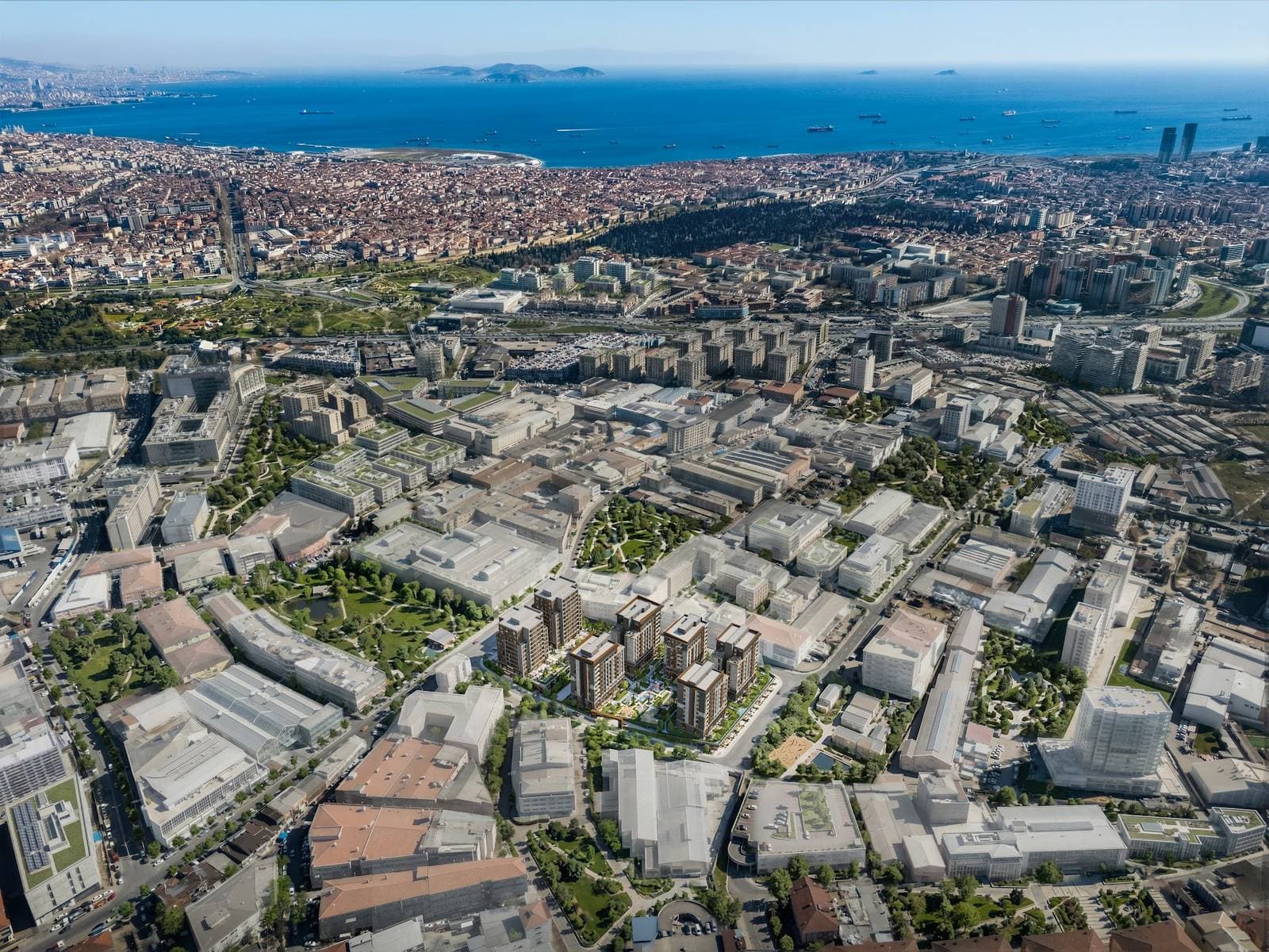 High aerial view of the project among the buildings of Zeytinburnu, with the Sea of Marmara and the Princes' Islands far in the distance