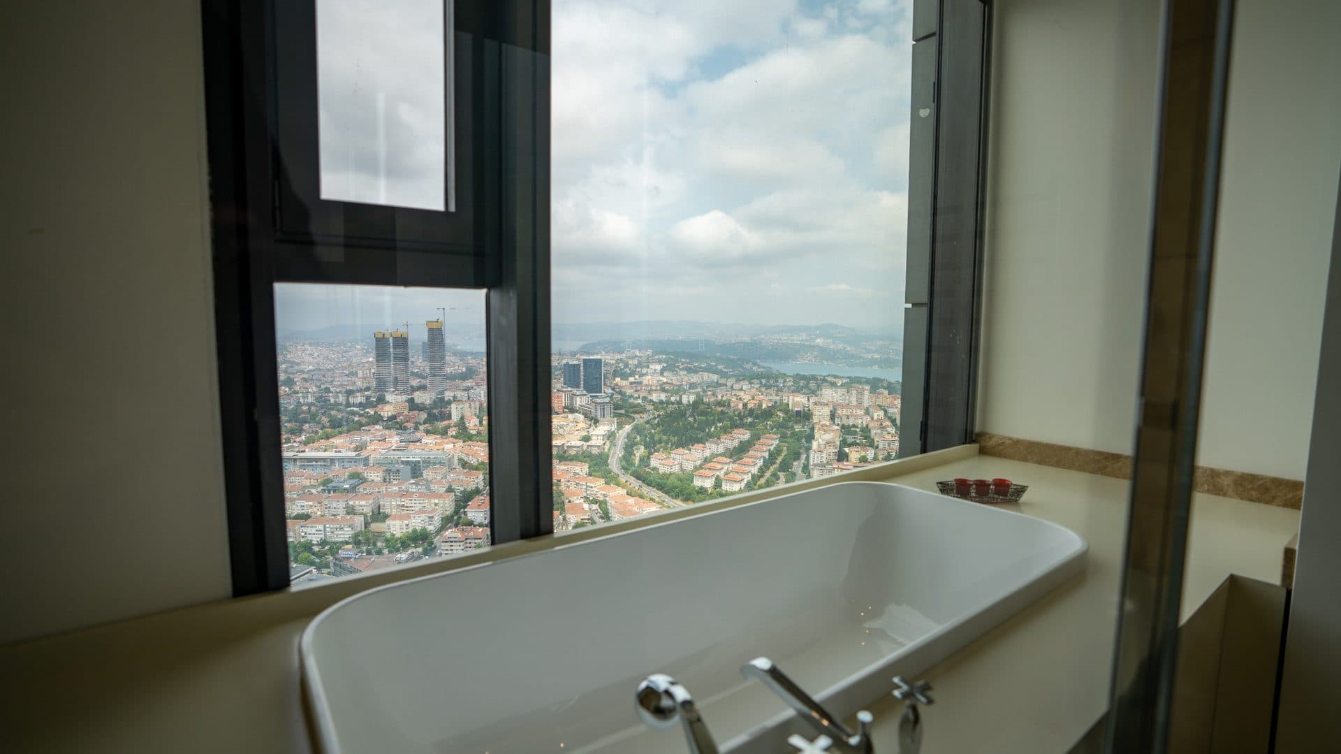 Bathtub beside a window looking out over the city toward the Bosphorus
