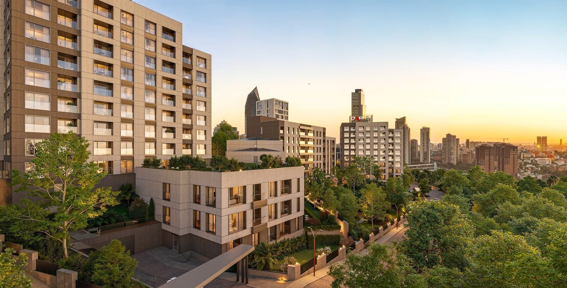 Residential block and a low-rise wing with a roof garden at sunset, with the Atasehir skyline in the background