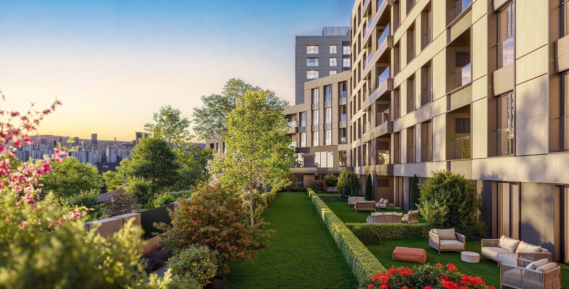 Private garden lawns with outdoor seating beside a residential block at sunset