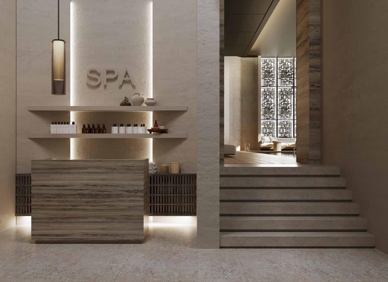 Spa reception desk with stone and wood finishes and stairs to the treatment rooms