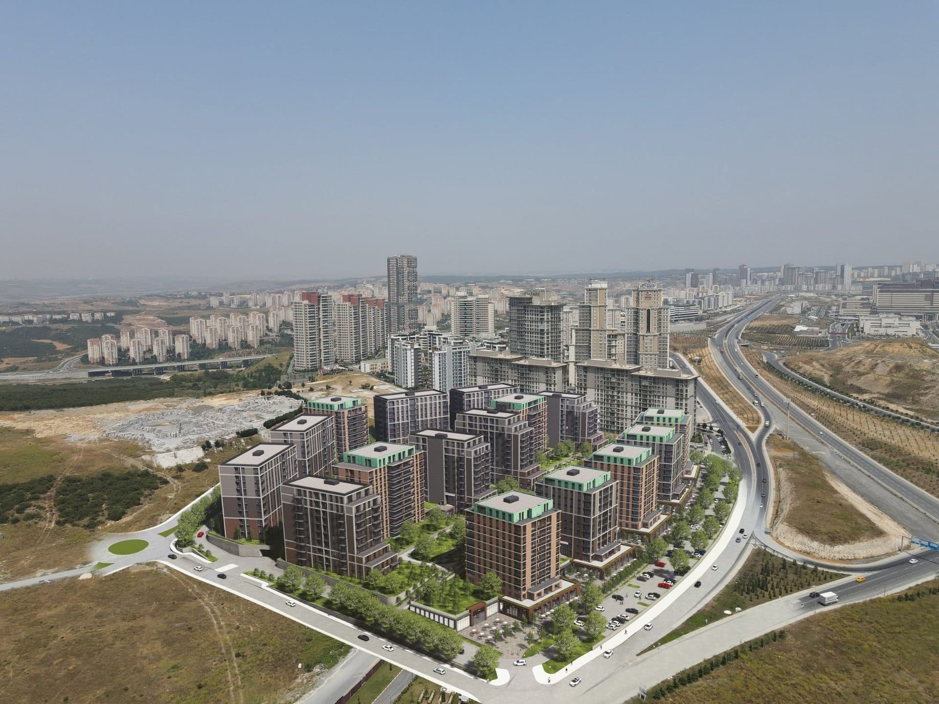 Photomontage of the planned complex placed into a drone photo of the area, with the boulevard and a motorway junction on the right