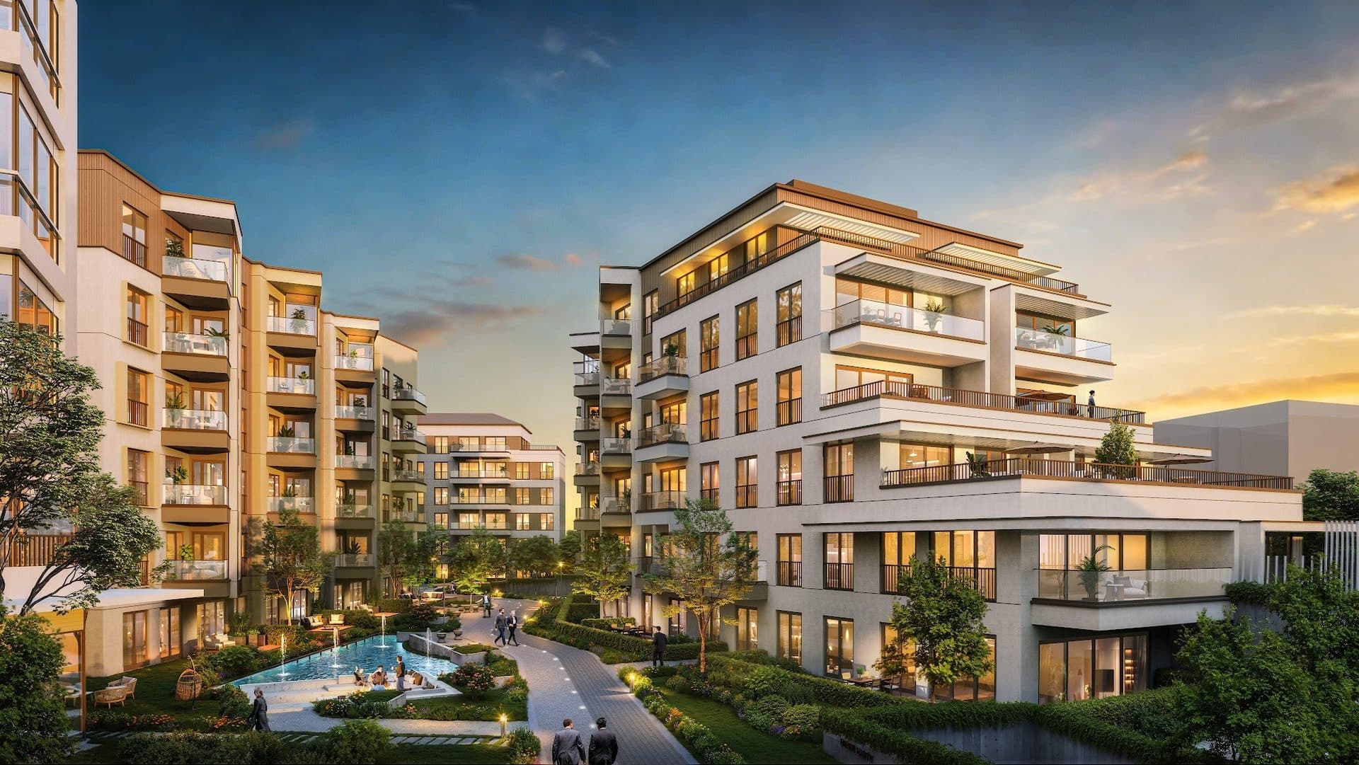 Rendered dusk view of the inner courtyard between the residential blocks, with a pool, lit paths, planting and terraced upper floors