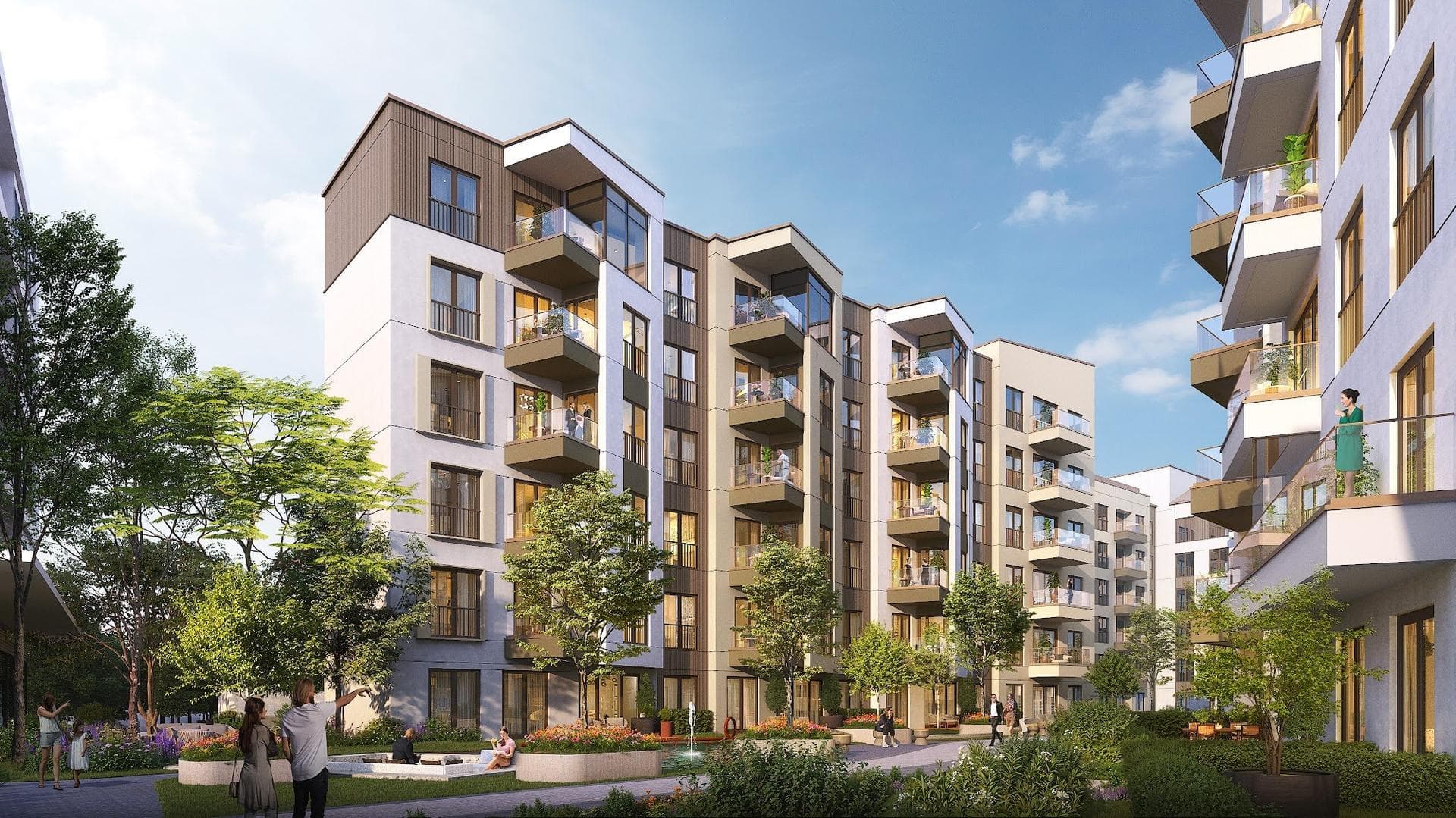 Residential blocks with balconies seen across the landscaped courtyard, with residents walking on the paths