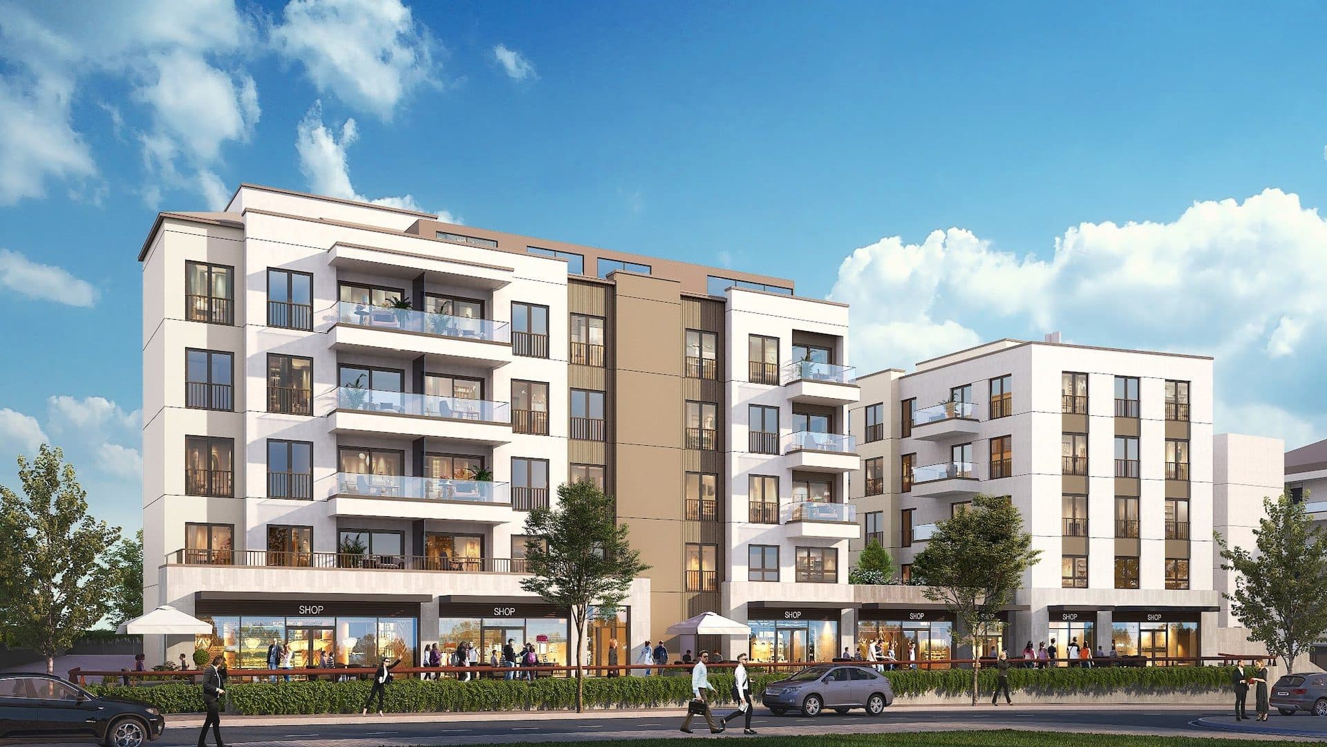 Street front of the project with shops on the ground floor and apartments with balconies above