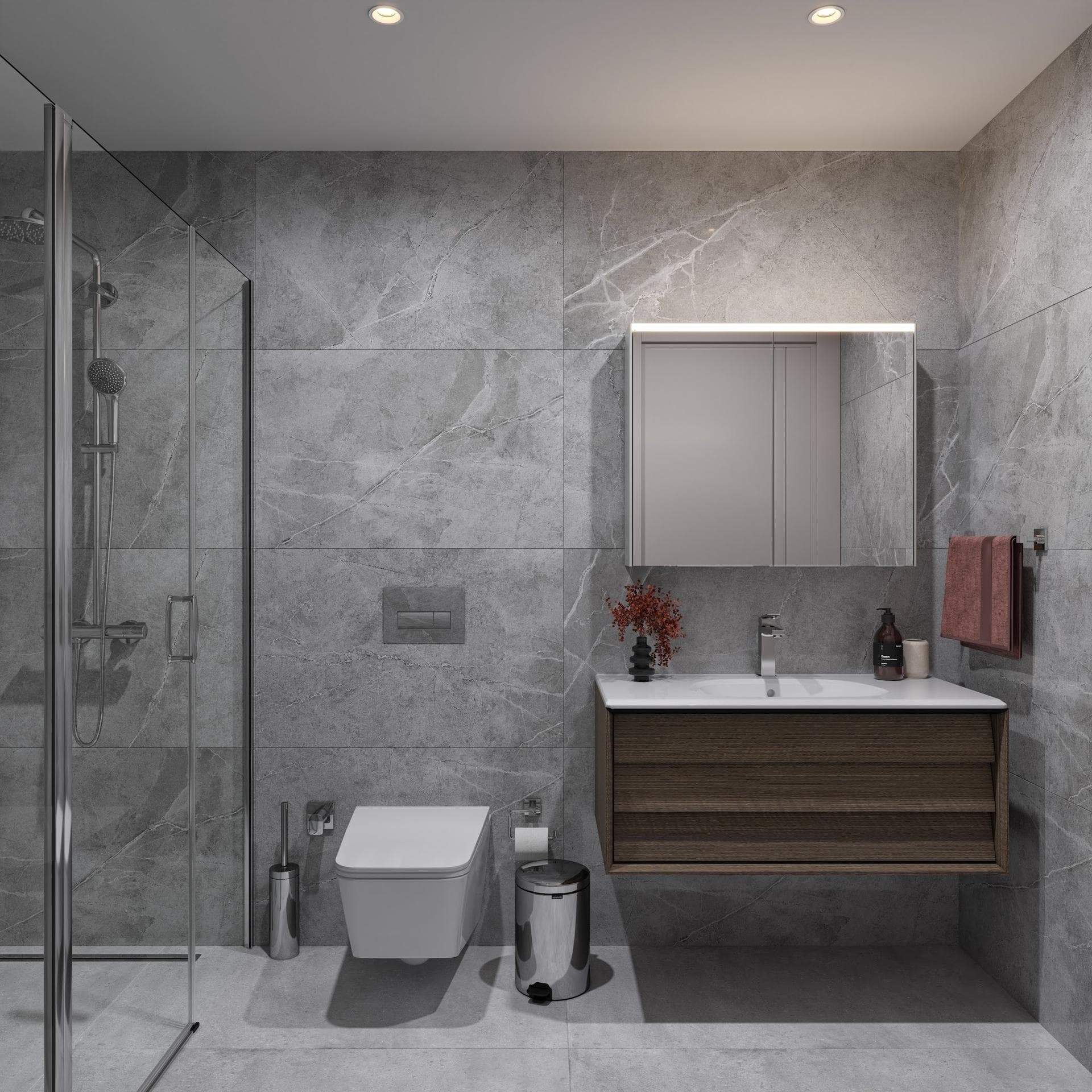 En-suite bathroom with a walk-in shower, wall-hung toilet and vanity unit in grey stone-look tiles