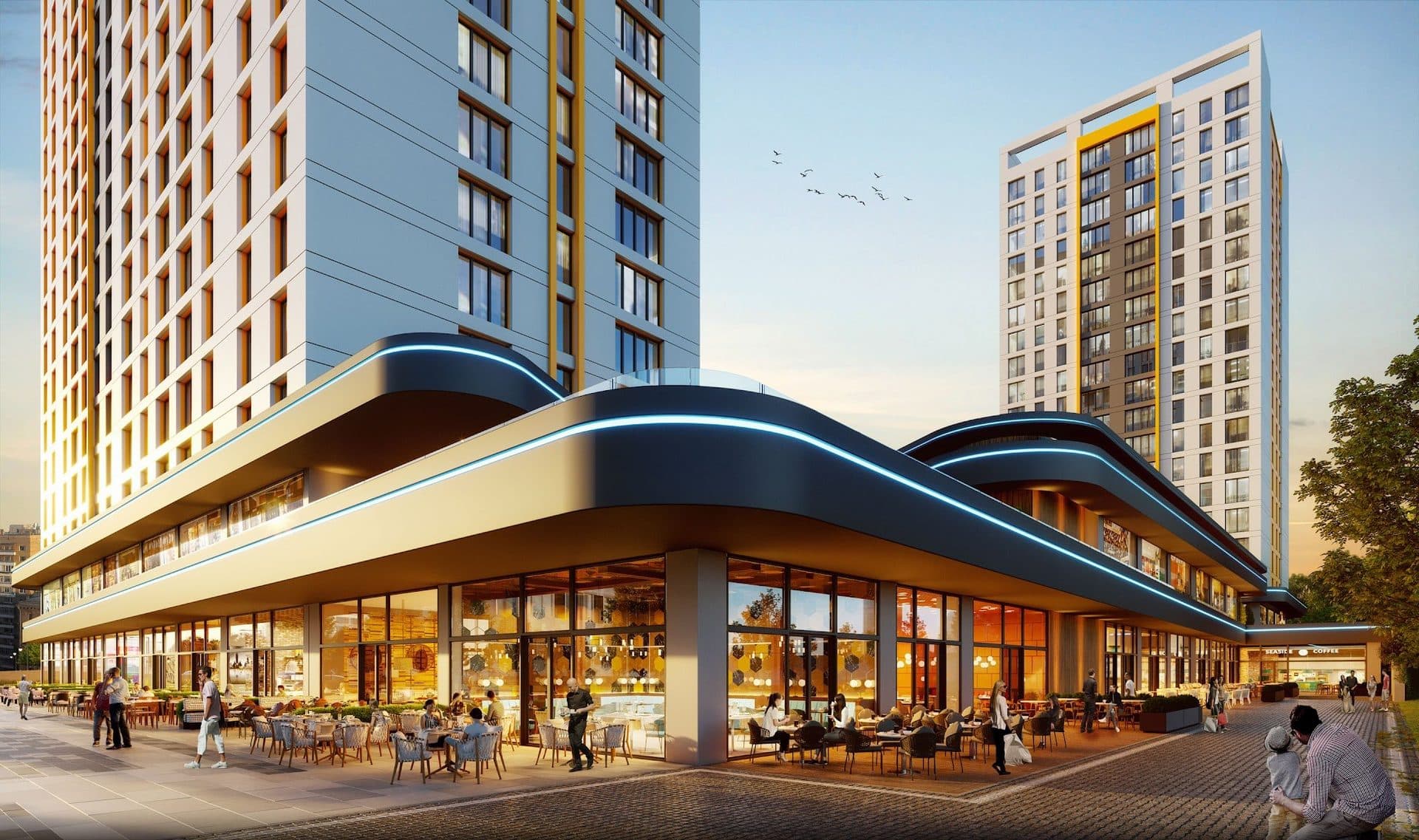 Rendering of the curved podium corner with a restaurant terrace and diners under lit canopies, the towers rising behind
