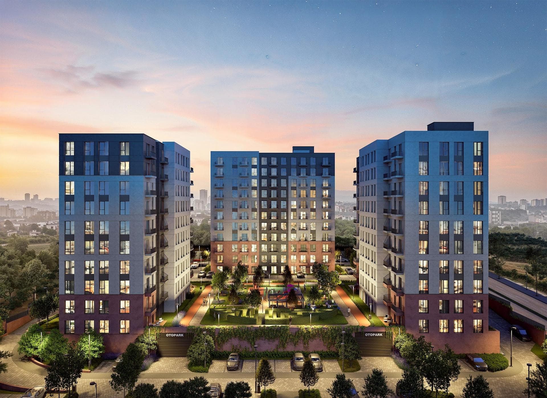 Night rendering of three blocks around a lit courtyard garden, with the entrances to the car park in front