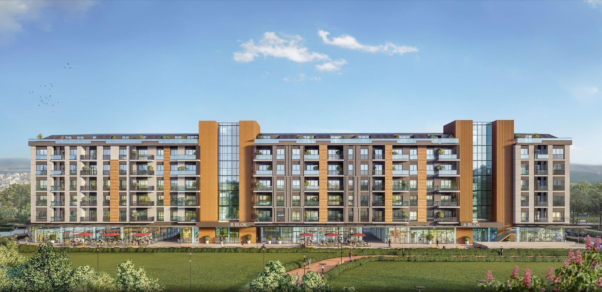 Rendered front view of Blocks A and B with wood-clad stair towers, balconies on five floors and a row of shops and cafes facing a lawn