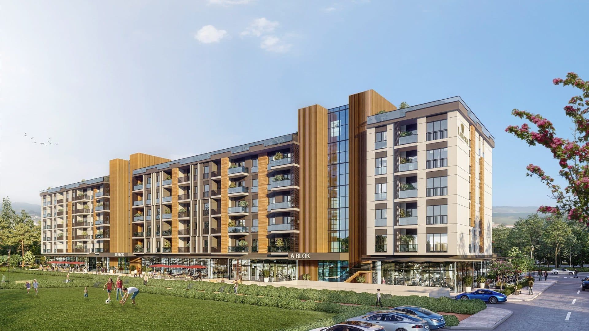 Rendered corner view of Block A with its glazed stair tower and wooden slats, shops at street level and a lawn where children play football