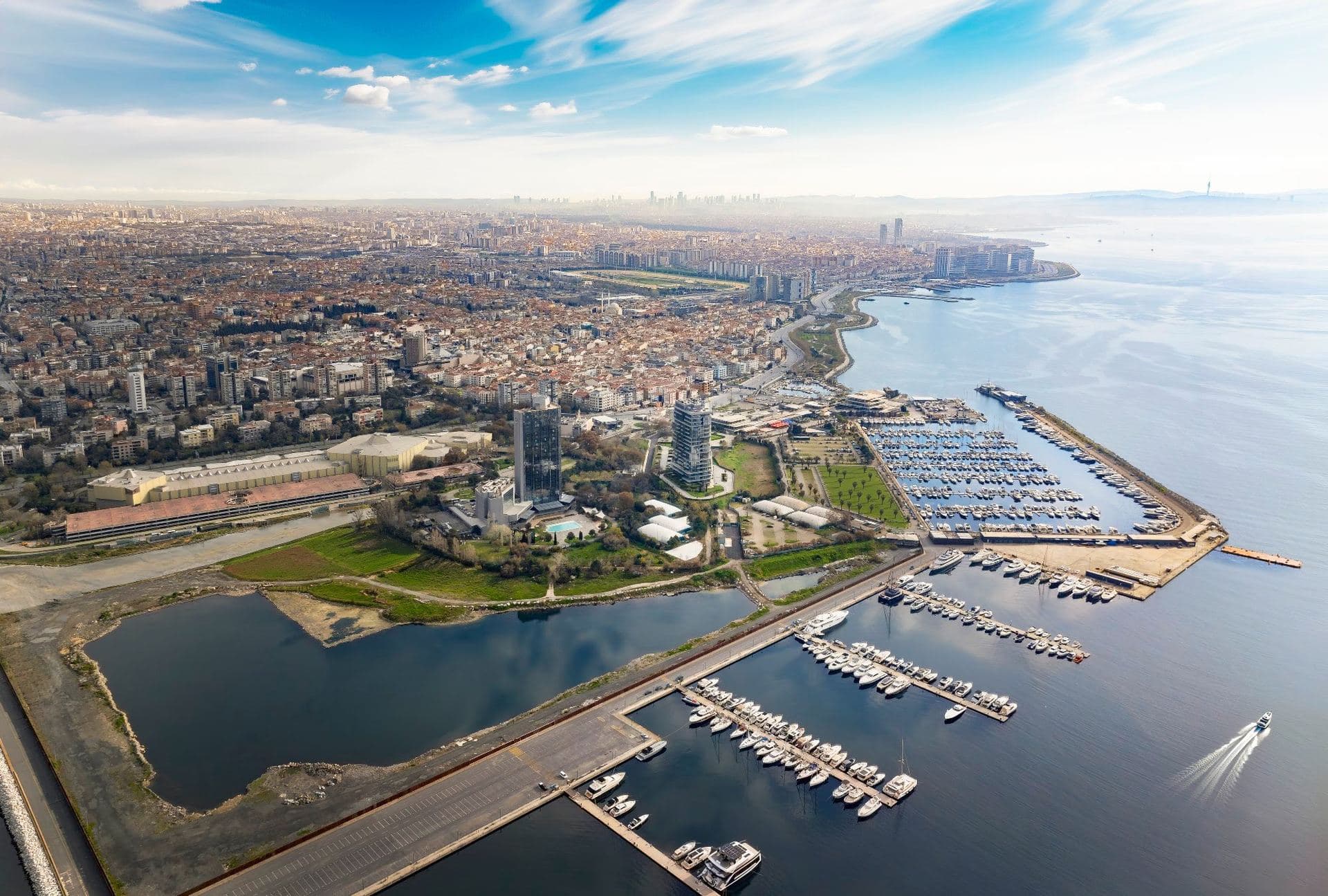 High aerial view of the Atakoy coast with the marina, the tower and the city stretching along the shore