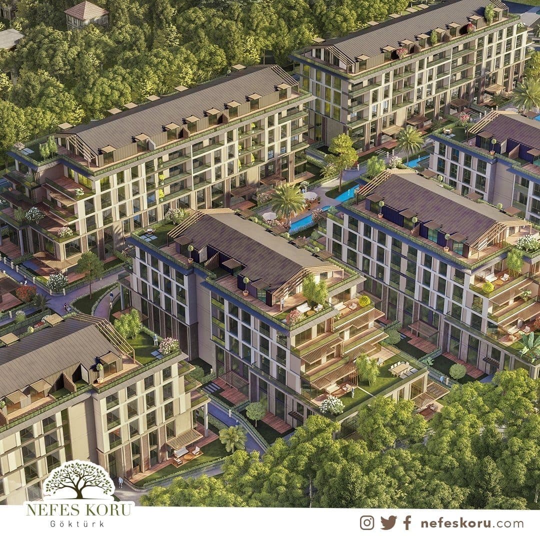 Rendered aerial view of several low-rise blocks with pitched roofs, roof terraces and gardens, set among woodland, with the developer's logo at the bottom