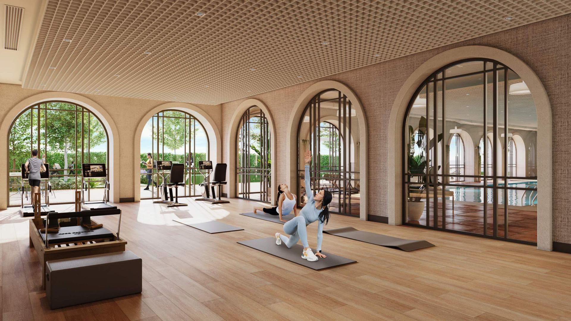 Gym and yoga room behind arched glass doors
