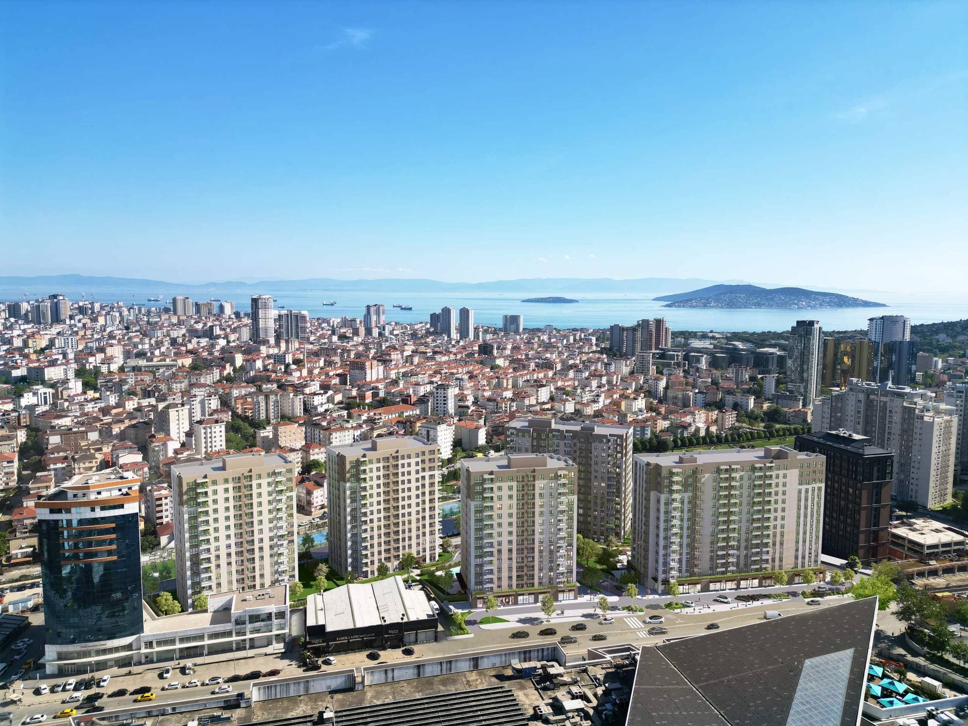 Aerial view of the five Ozak Dragos blocks in Maltepe, with the Sea of Marmara and the Princes' Islands behind