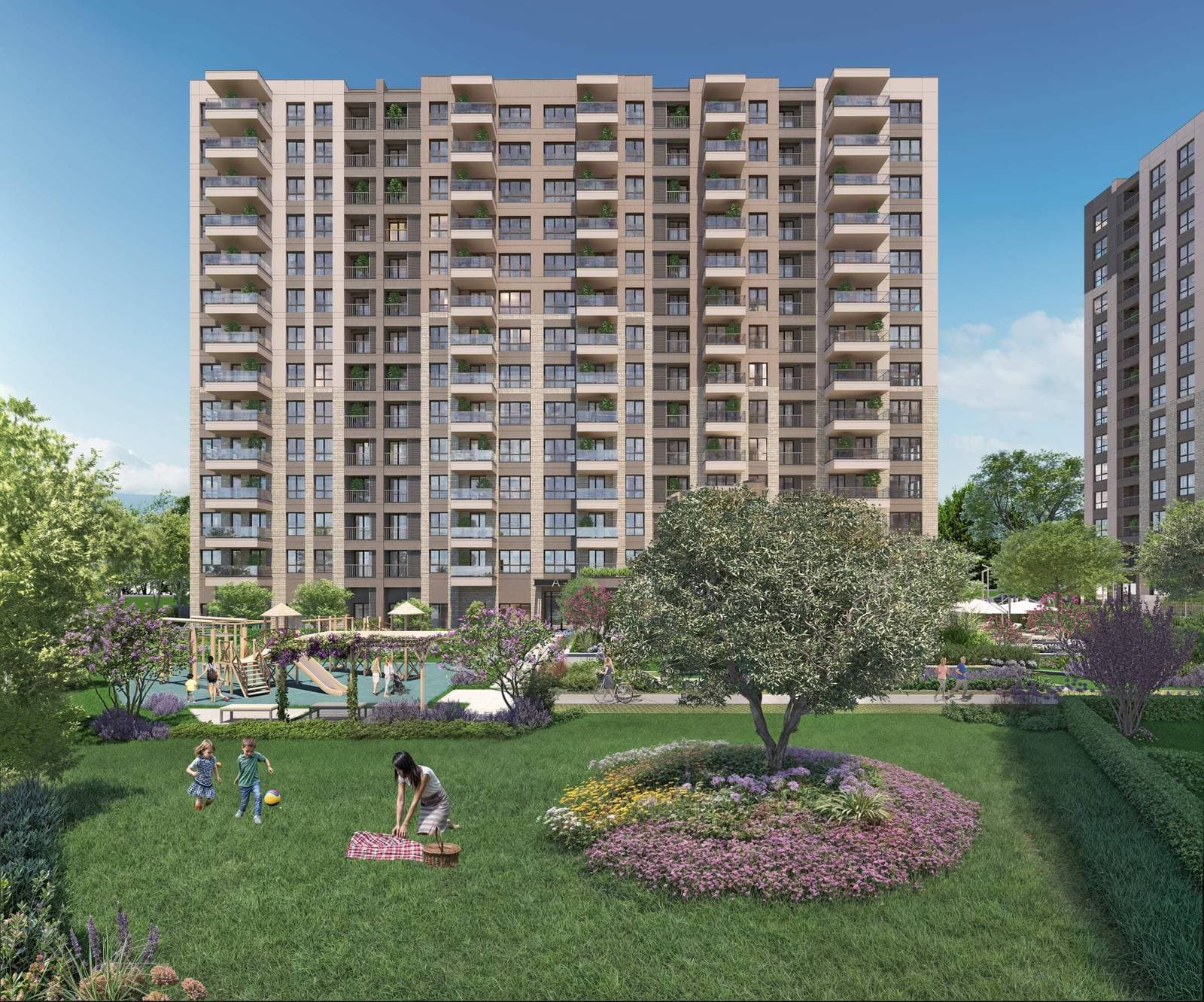 Lawn and flower beds in front of a residential block