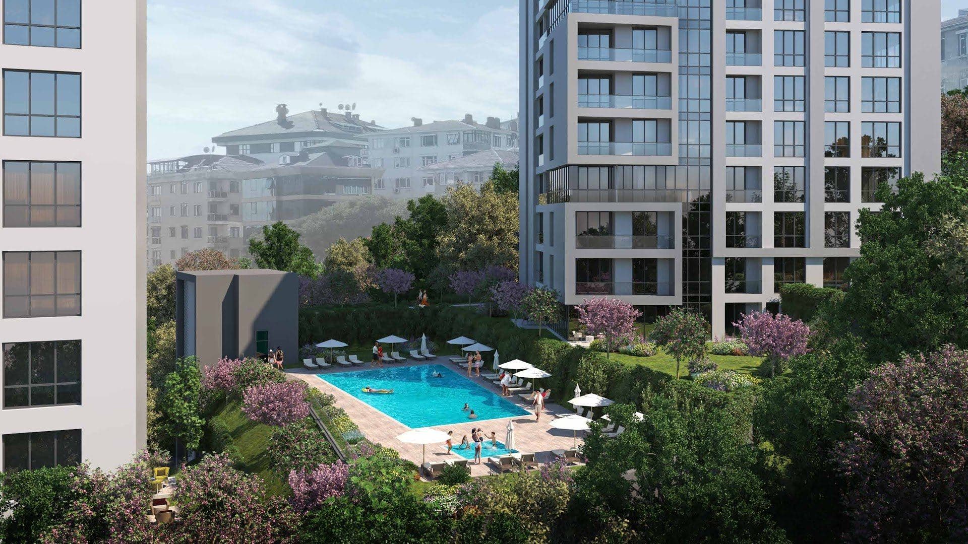 Outdoor swimming pool and children's pool with sun loungers and umbrellas in the landscaped garden
