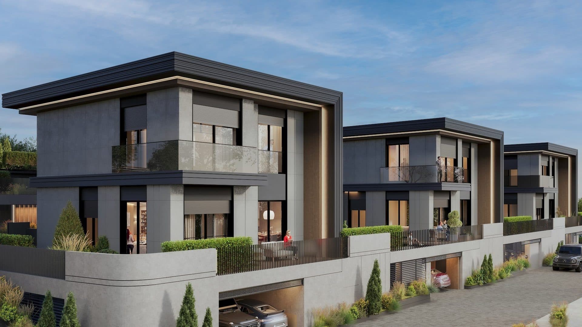 Row of detached villas with dark flat-roof frames and glass balconies, their garden terraces raised above street-level garages