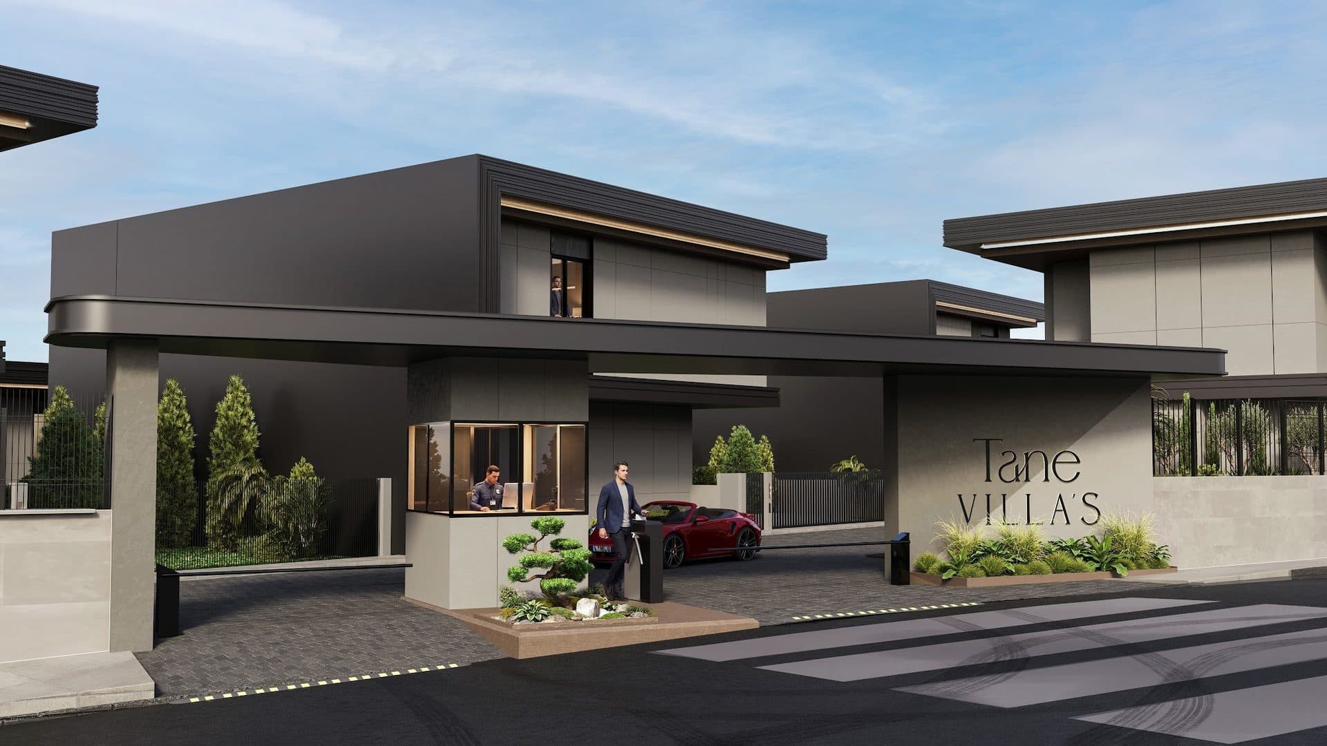 Gated compound entrance with a security booth, a barrier and the Tane Villas sign under a long canopy