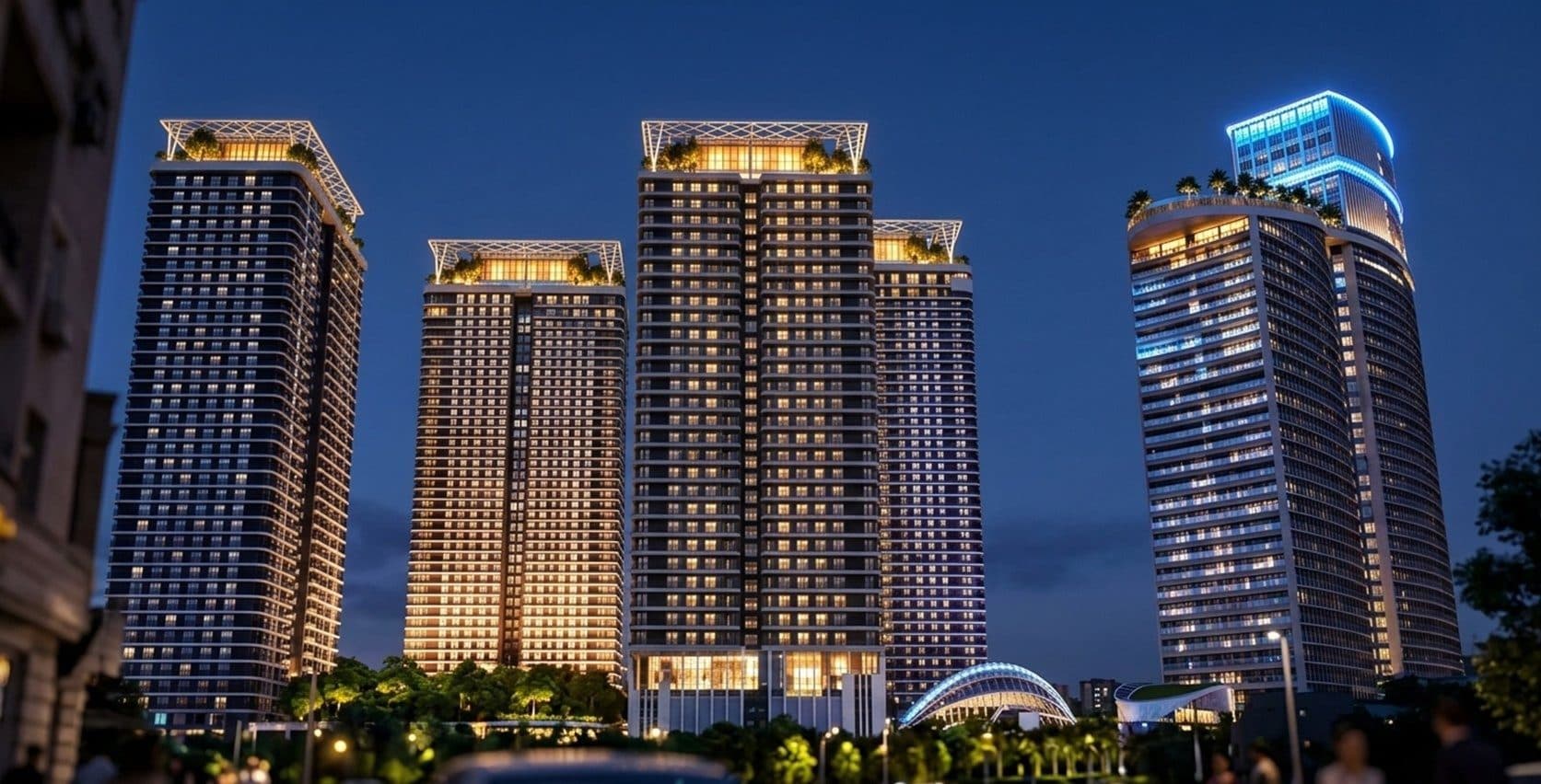 The towers lit up at night, seen from the street