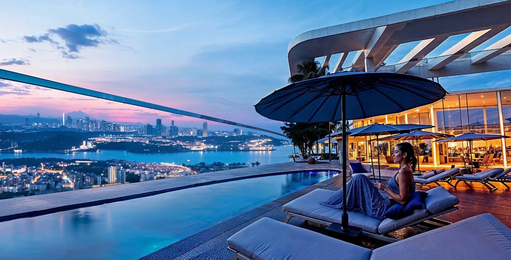 Rooftop infinity pool with sun loungers and a view over the Bosphorus at dusk