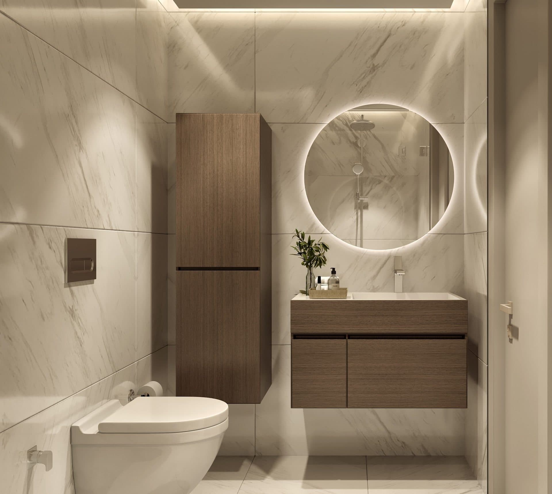 Rendering of a bathroom with marble-look tiles, a wood vanity, a round backlit mirror and a wall-hung toilet